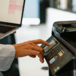 Procurement professional using office equipment representing public sector purchasing and cooperative contract usage